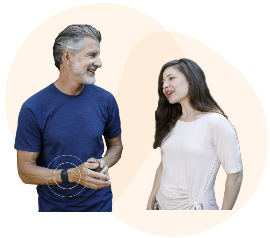 A man and a woman talking to each other. The guy wearing a wristband